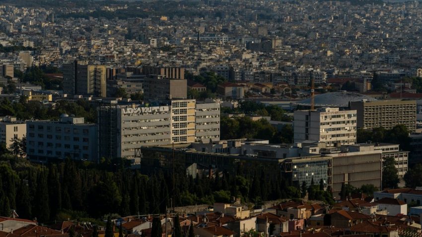 a city with lots of tall buildings and lots of trees